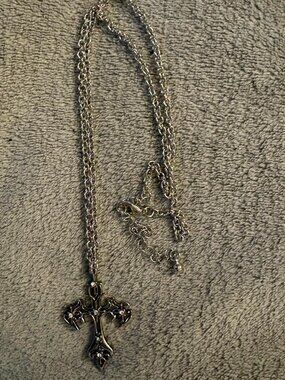 stylized silver skater cross